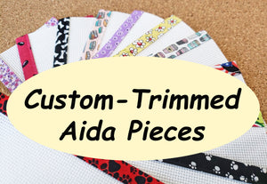 Aida fabric pieces with handmade trim